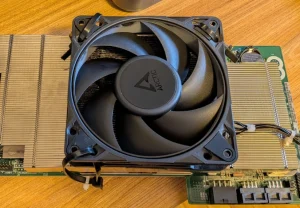 amd bc 250 one cooler 120 mm fan zip-tied on top of the BC-250 heatsink