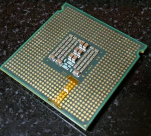 lga771 775 mod LGA771 to LGA775 mod: Xeon with adapter sticker and trimmed socket keys
